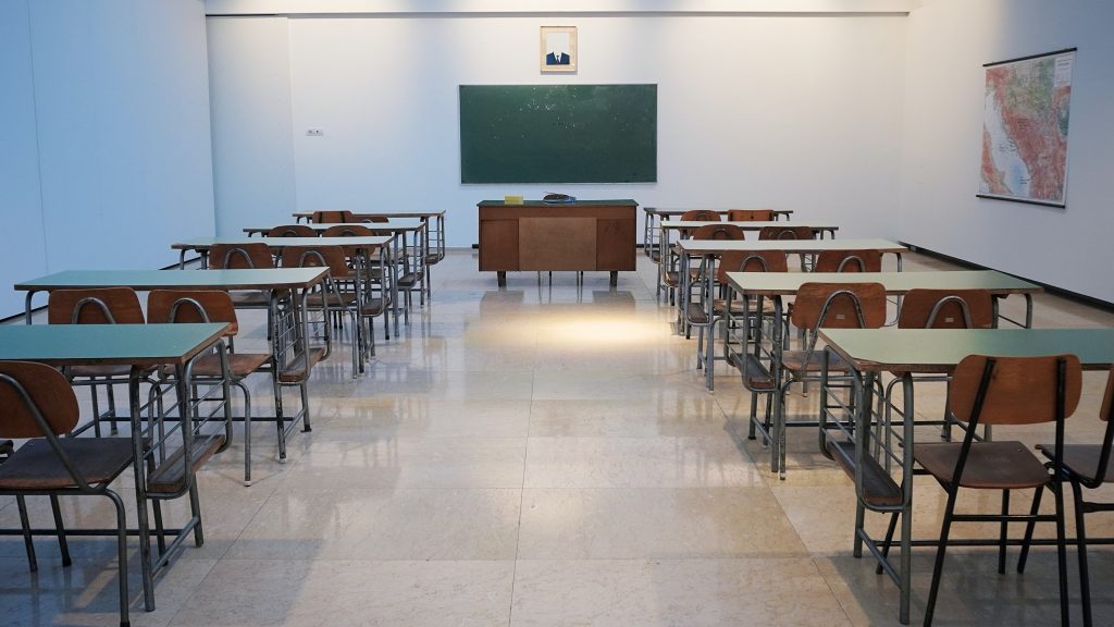 Empty classroom with empty desks.