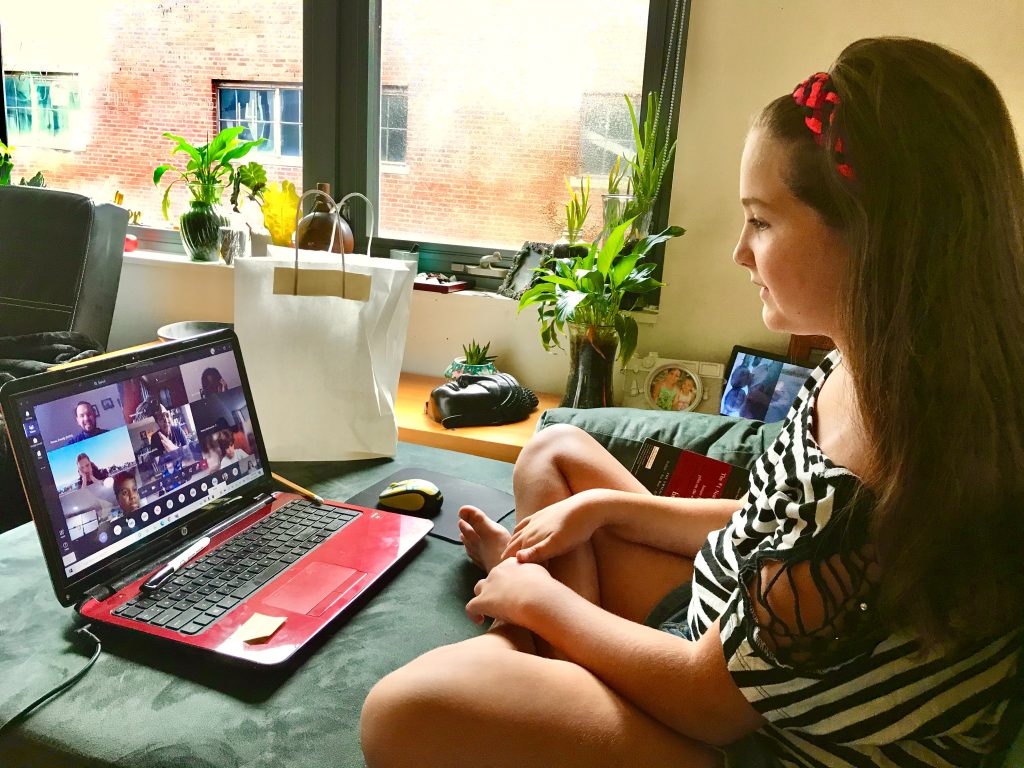 young student using an online learning platform on their laptop